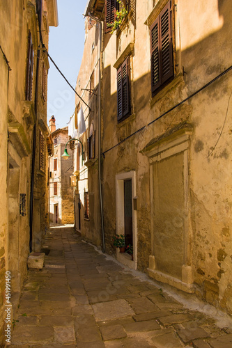 A residential road in the historic medieval hill village of Buje in Istria, Croatia 