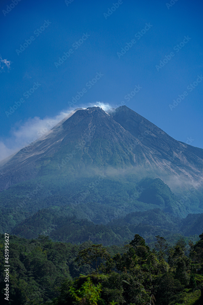 awesome view of Mount Merapi in the morning and emitting smoke, a mountain that is still active until now awesome view of Mount Merapi in the morning and emitting smoke, a mountain that is still active until now