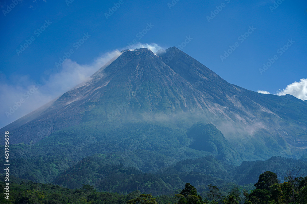awesome view of Mount Merapi in the morning and emitting smoke, a mountain that is still active until now awesome view of Mount Merapi in the morning and emitting smoke, a mountain that is still active until now