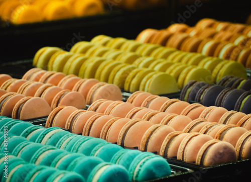 Colorful tasty macaroons. Sweet almond cookies macrons. Close up and Selective focus of french sweet delicacy.