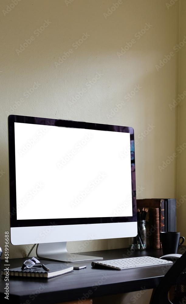 Fototapeta premium Modern workplace with computer and office supplies on wooden desk.