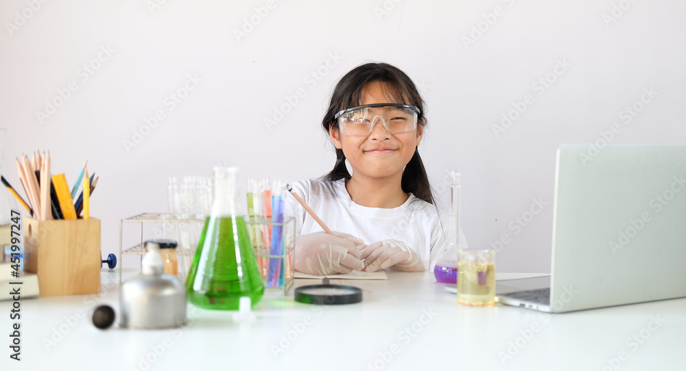 Asian student doing chemical experiment in the laboratory. Asian student doing chemical experiment in the laboratory.