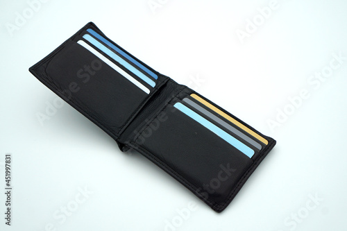 Fototapeta Naklejka Na Ścianę i Meble -  Men's leather wallet with several cards in it on isolated white background 