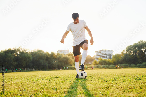 One person only. Young soccer player have training on the sportive field