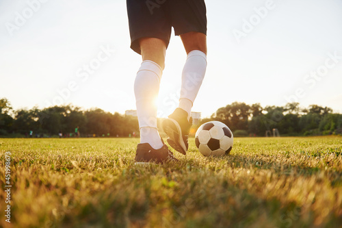 Close up view. Young soccer player have training on the sportive field