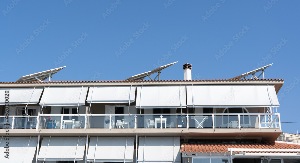 Solar panels on the roof of a house in Greece