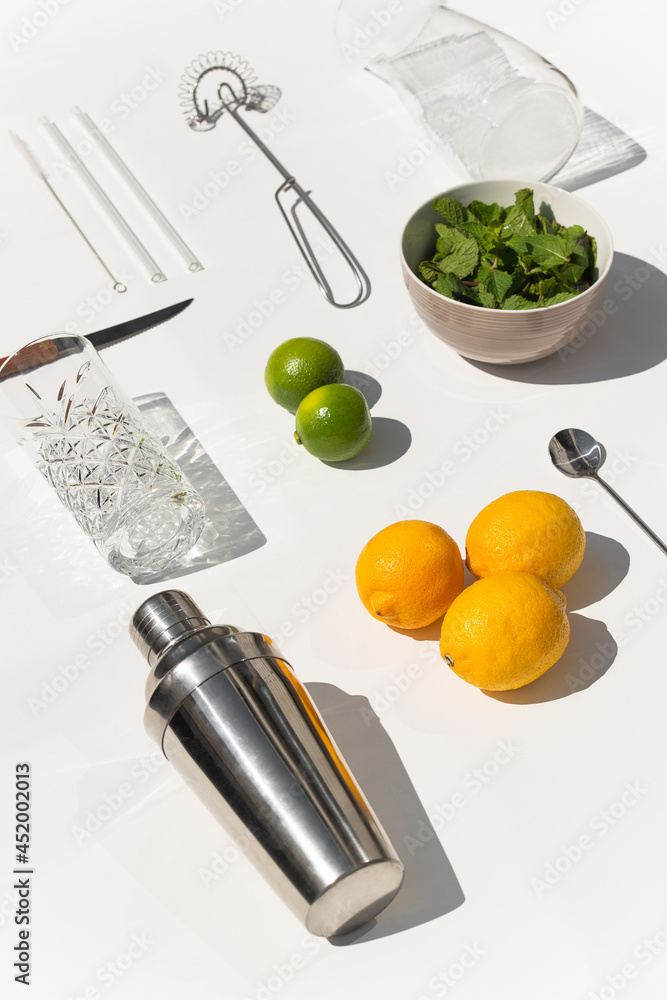 Photo of ingridients for refreshing summer lemonade cocktail with fresh citrus lime lemon and green mint and cocktail bar tools outdoors with white background flat lay style
Photo of ingridients for refreshing summer lemonade cocktail with fresh citrus lime lemon and green mint and cocktail bar tools outdoors with white background flat lay style