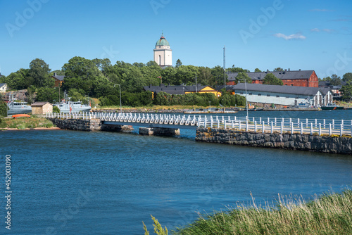 Views of Iso Mustaari Island in Suomenlinna with Suomenlinna Church on background - Helsinki, Finland photo