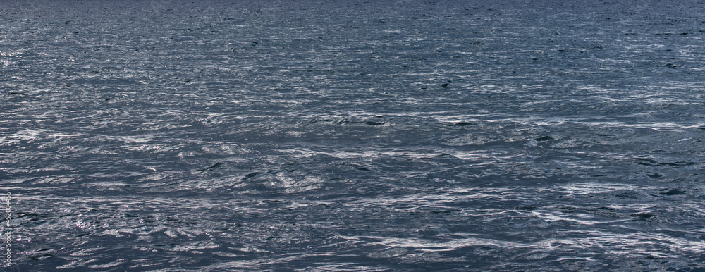 Fototapeta premium texture of surface of blue water - sea background