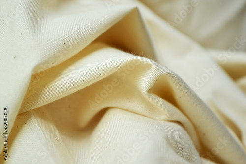 Simple sewing material. Light canvas. Wallpaper or background 
