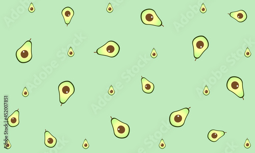 Avocado background. Ripe avocado halves on a delicate green background.