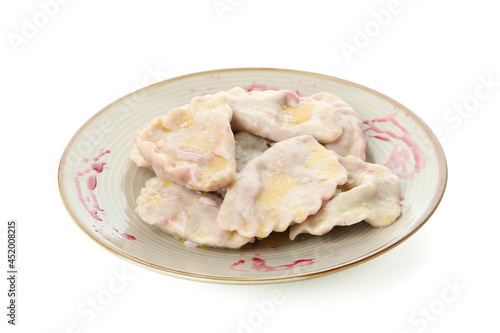 Plate with pierogi with cherry isolated on white background