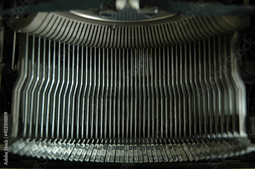 Vintage typewriter background. Typebars in a shallow depth of field. © Mr.Profile