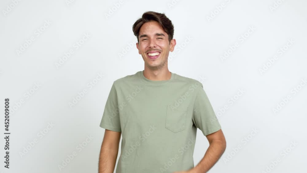 Young man keeping the arms crossed while smiling over isolated background Young man keeping the arms crossed while smiling over isolated background