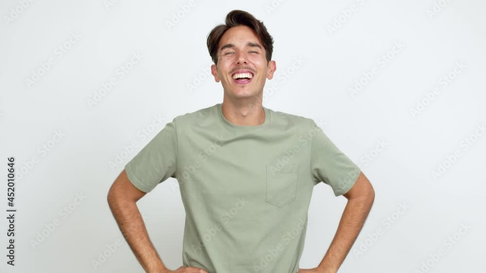 Young man smiling a lot while covering mouth over isolated background Young man smiling a lot while covering mouth over isolated background