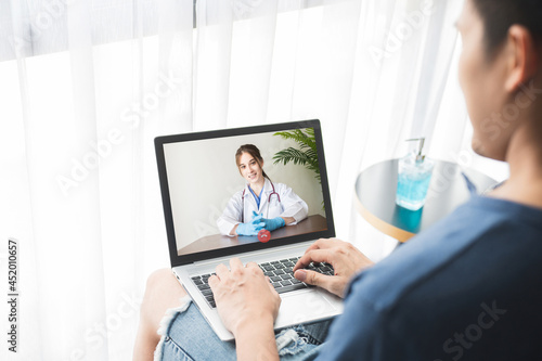 Male patient talking with doctor. Doctor telemedicine service online video for virtual patient health medical chat . Remote doctor healthcare consultant from home  .