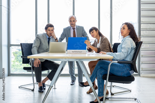 Businesspeople discussing together in the conference room during meeting at the office.