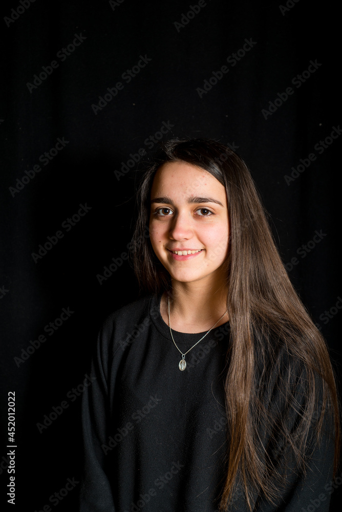 portrait of teenage girl with black background -smiling girl with long hair portrait- portrait of teenage girl with black background -smiling girl with long hair portrait-