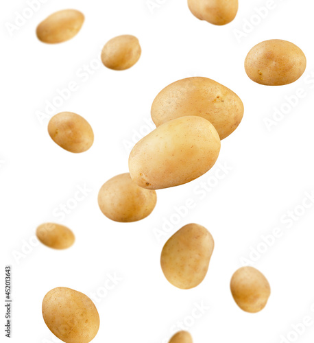 Young fresh potatoes fly in space. Each potato isolated on white. Excellent quality and detail.