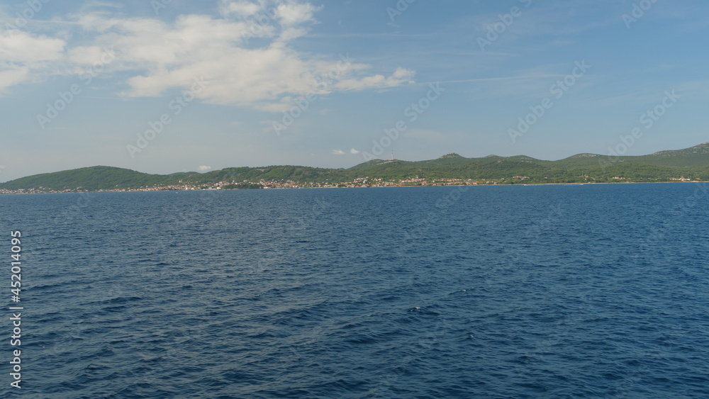 Croatian boat trip on the see during a summer day with island background | landscape