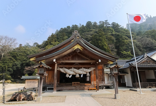 A shinto shrine in Izumo, Japan with the Japanese flag