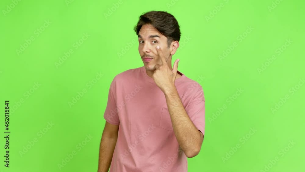 Young man looking front over isolated background. Green screen chroma key Young man looking front over isolated background. Green screen chroma key