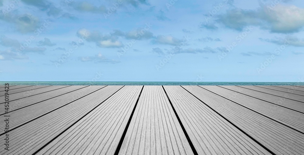 Panorama of Wood perspective on sea image background. Empty top of wooden table. wood table top on blurred blue sea Panorama of Wood perspective on sea image background. Empty top of wooden table. wood table top on blurred blue sea