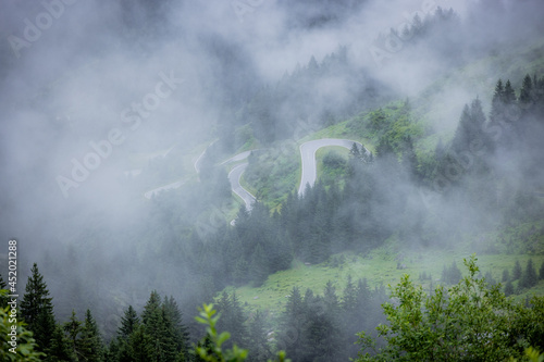 A rainy day in the Austrian Alps with deep clouds and fog - travel photography