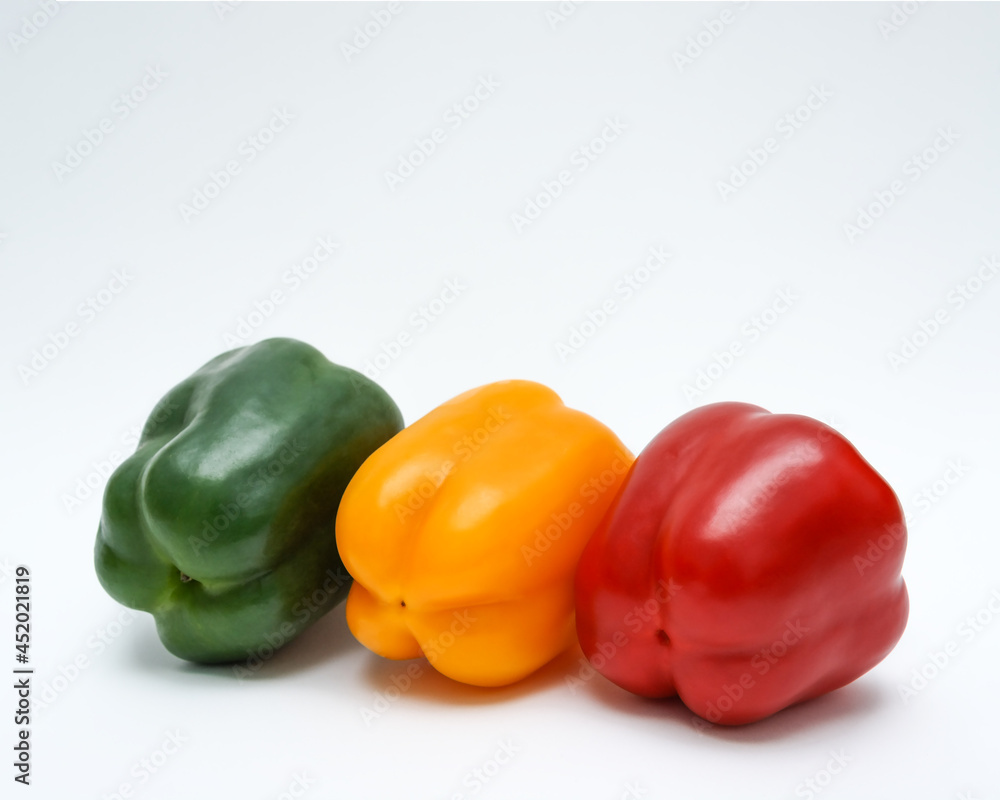 Bell pepper three colors red, yellow and green on white background. Various of colorful bell peppers Bell pepper three colors red, yellow and green on white background. Various of colorful bell peppers