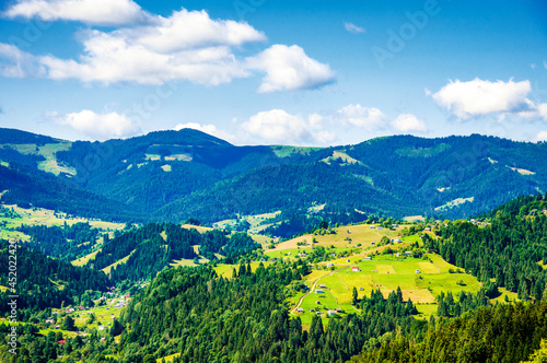 view from the top of the mountain to the village.Carpathians morning landscape. High quality photo