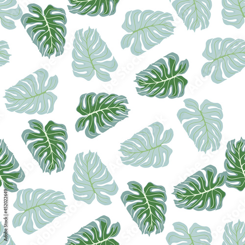 Abstract tropic nature seamless pattern with green and blue random monstera leaf print. Isolated artwork.