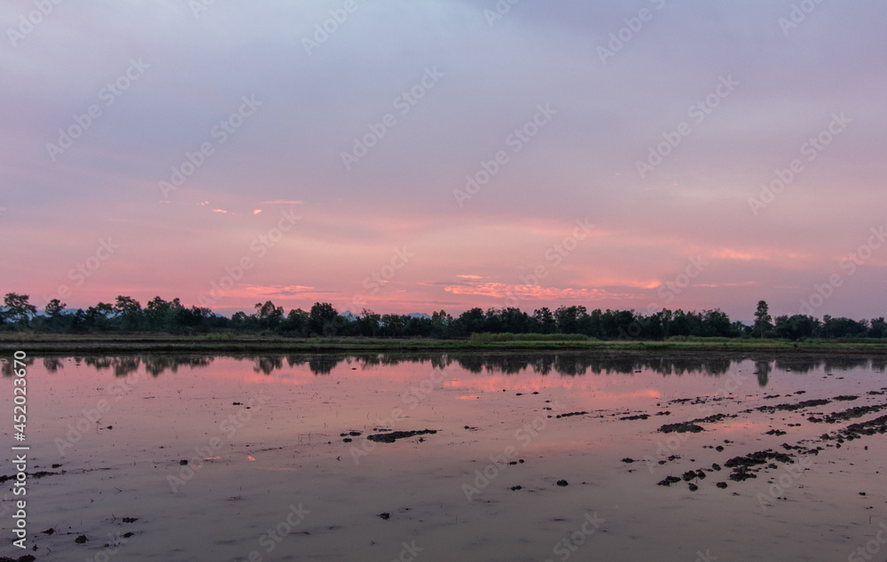 Obraz premium sunset over the river