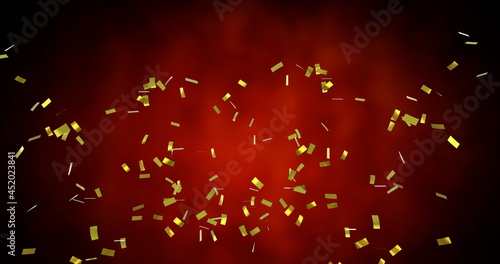 Image of golden confetti falling over glowing red background