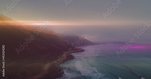 Light trail against sea in background