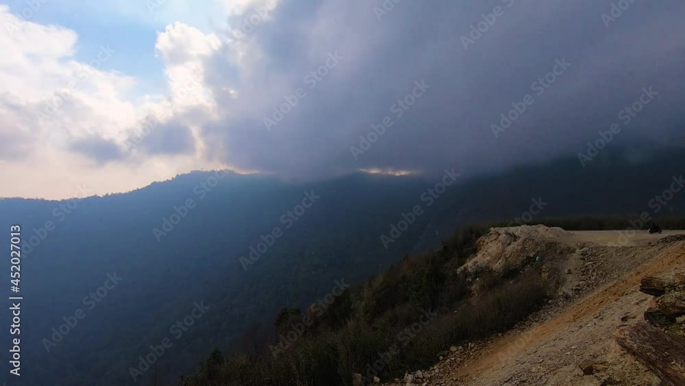 dramatic moody sky covered with heavy low clouds and mountain background at morning dramatic moody sky covered with heavy low clouds and mountain background at morning