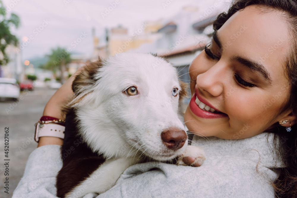 Happy woman hugging with dog Happy woman hugging with dog