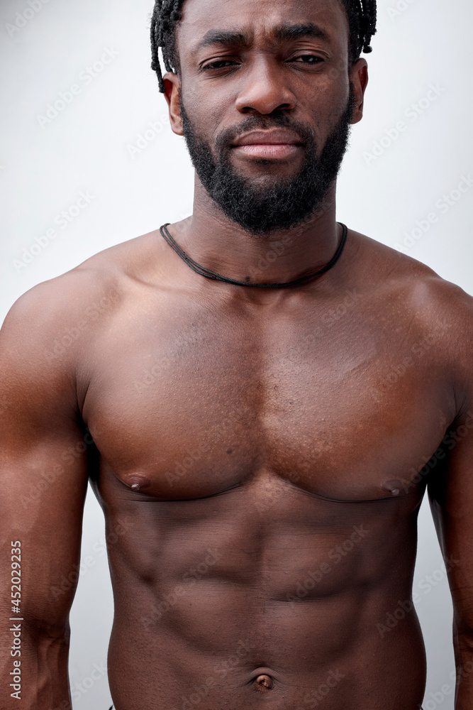 Serious and thoughtful naked african american young man isolated on white  studio background, handsome guy without clothes look at camera confidently,  thinking, serious. Muscular guy Copy space Stock Photo | Adobe Stock