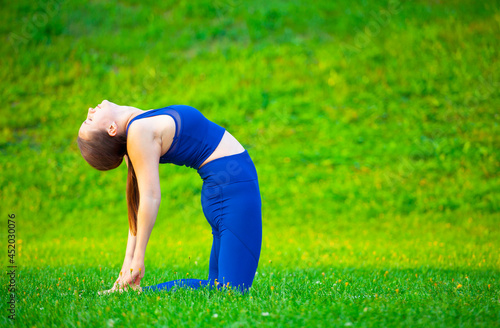 image of woman yoga grass background