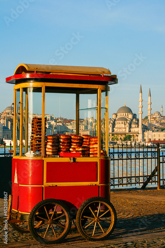 Photography Cart with Turkish bagels known as Simit with the skyline of Istanbul, Turkey