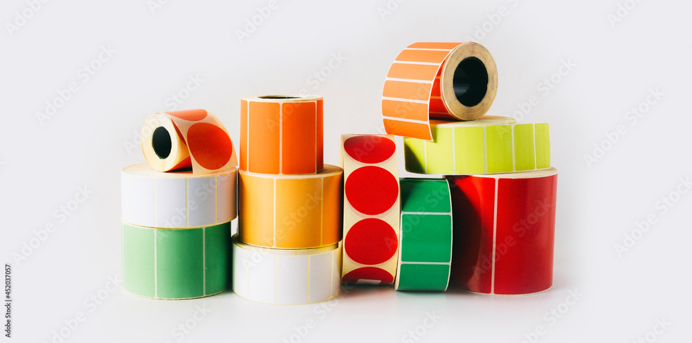 Colored and white reels with self-adhesive labels for ...