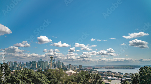 Seattle Skline and Harbor with Blue Skies and White Clouds