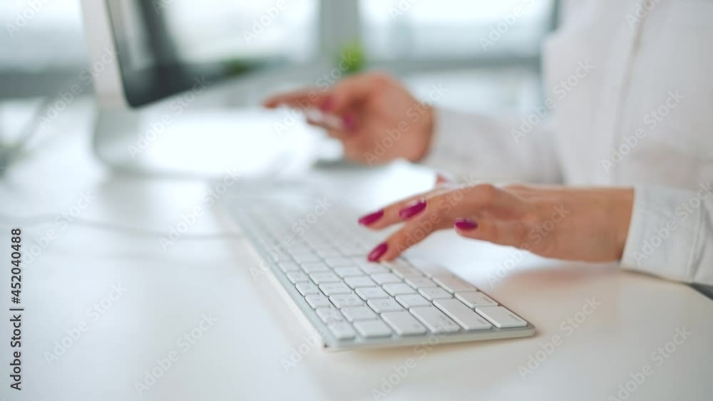 Woman typing credit card number on computer keyboard. She making online purchase. Online payment service. Woman typing credit card number on computer keyboard. She making online purchase. Online payment service.