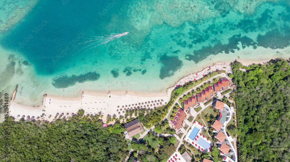 Aerial view of a paradise beach next to a villa resort in Baru, Cartagena, Colombia