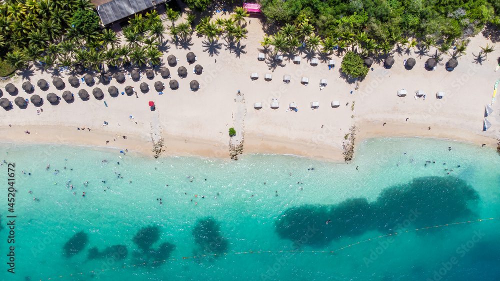 Aerial view of a paradise beach with turquoise water in Baru, Cartagena, Colombia
