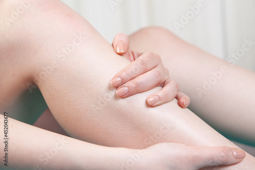 a young girl has a leg pain
