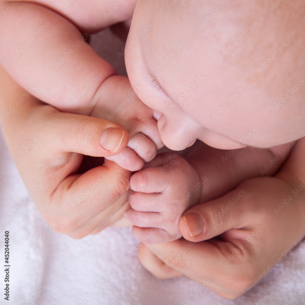 Cute baby hands holding mother's fingers. Cute baby hands holding mother's fingers.