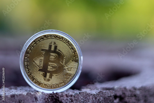 Bitcoin gold coin and defocused background. Virtual cryptocurrency concept.