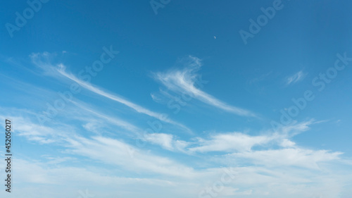 White clouds and blue sky and moon suitable for background