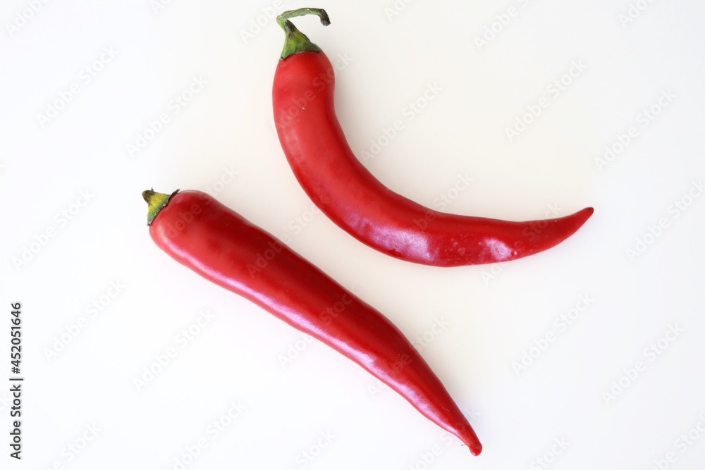 Two red chili peppers
