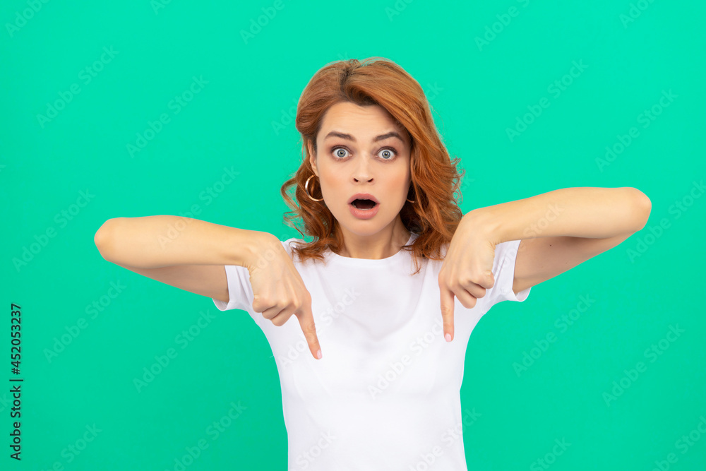 look there. shocked woman with curly hair point finger down. beauty and fashion. look there. shocked woman with curly hair point finger down. beauty and fashion.